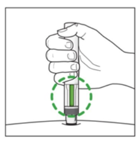 Produkt został wprowadzony w skórę, a kropkowane zielone kółko podkreśla obszar, w którym okienko na wstrzykiwaczu jest wypełnione na zielono po pomyślnym włożeniu